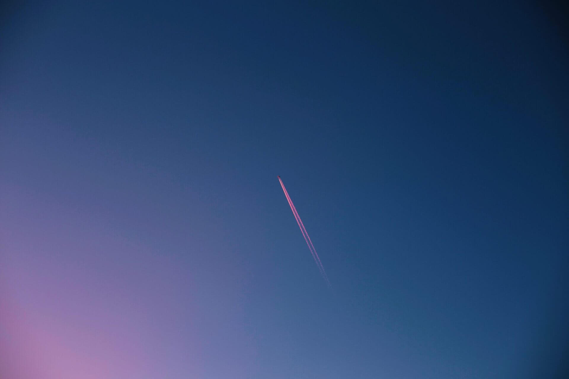 A jet flying across a clear evening sky
