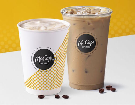 McCafe iced and hot coffees on a white table