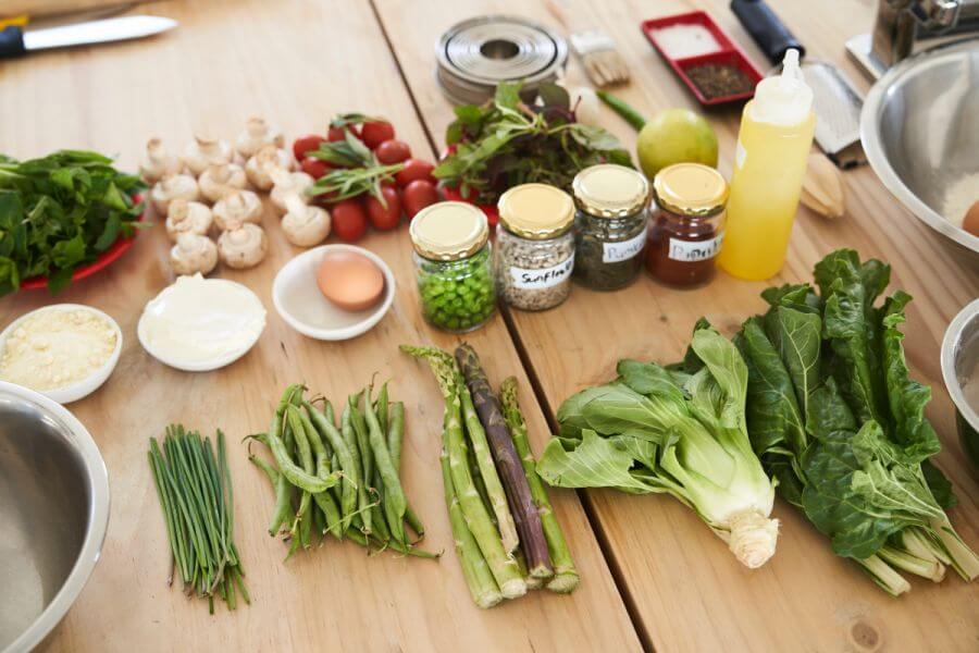 Vegetables and spices on a wooden table