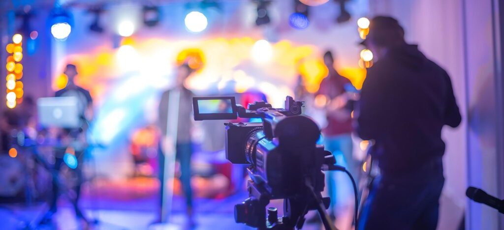 Behind camera filming concert
